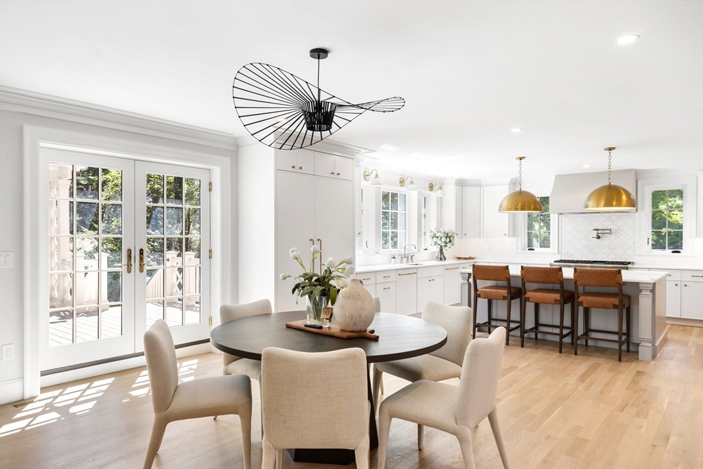 2 Percy Road Lexington, MA 02421 - Photo 9 of 31 a dining room with furniture a window and wooden floor