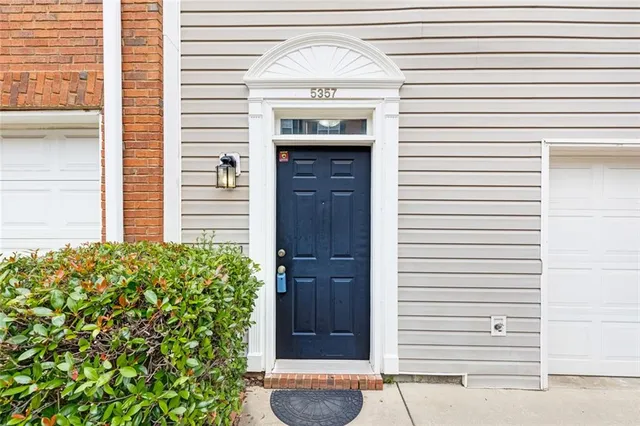 a view of front door and a window