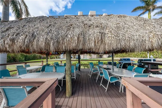 a view of a chairs and table in patio