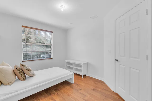 a bedroom with a bed and window