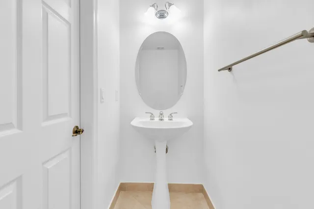 a bathroom with a sink and mirror