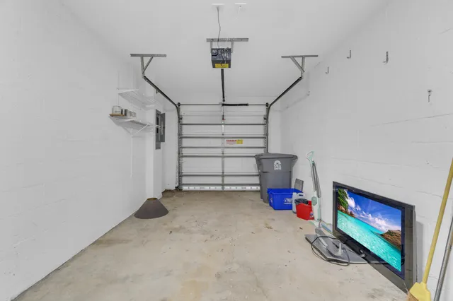 a view of empty room with staircase and fireplace