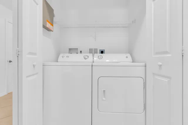 a utility room with dryer and washer