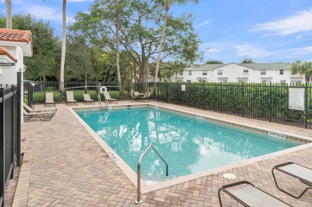a view of a swimming pool with a patio