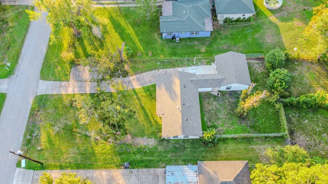 an aerial view of a house with swimming pool