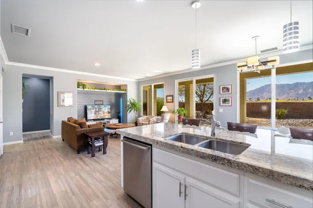 a kitchen with sink and refrigerator