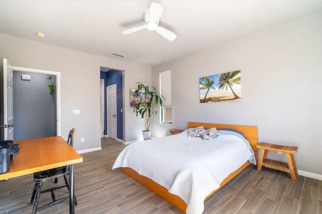 a bedroom with a bed and a table in it