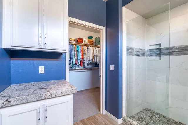 a view of a sink and cabinets