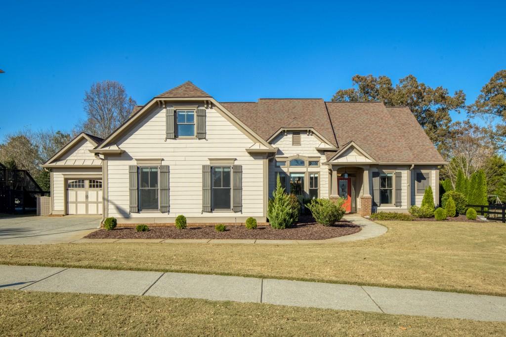 a front view of a house with a yard