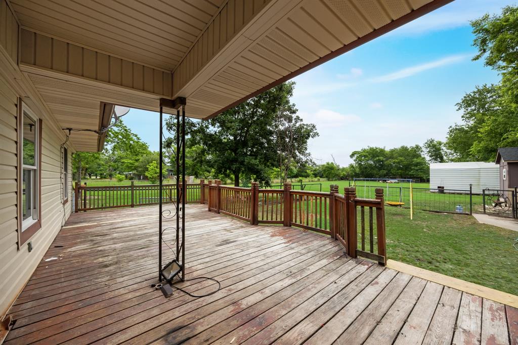 571 South 1st Street Point, TX 75472 - Photo 19 of 27 a house view with a garden space