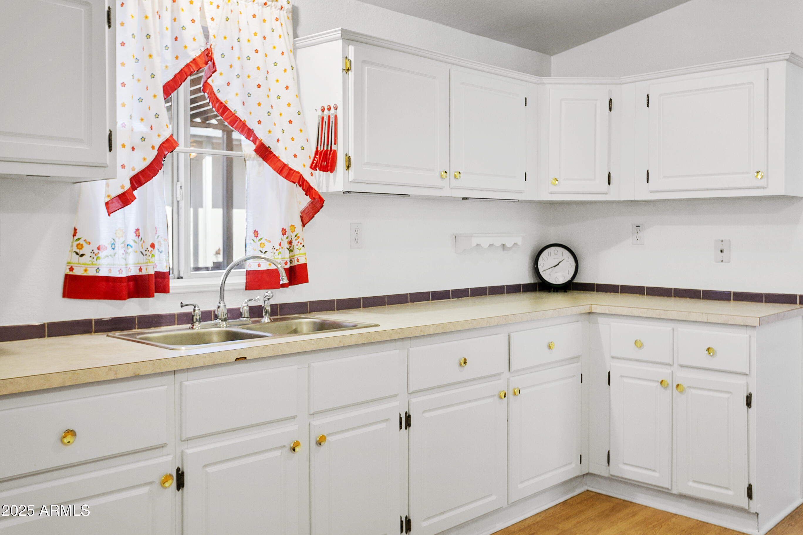 16416 North 33rd Way Phoenix, AZ 85032 - Photo 14 of 31 a kitchen with white cabinets and white appliances