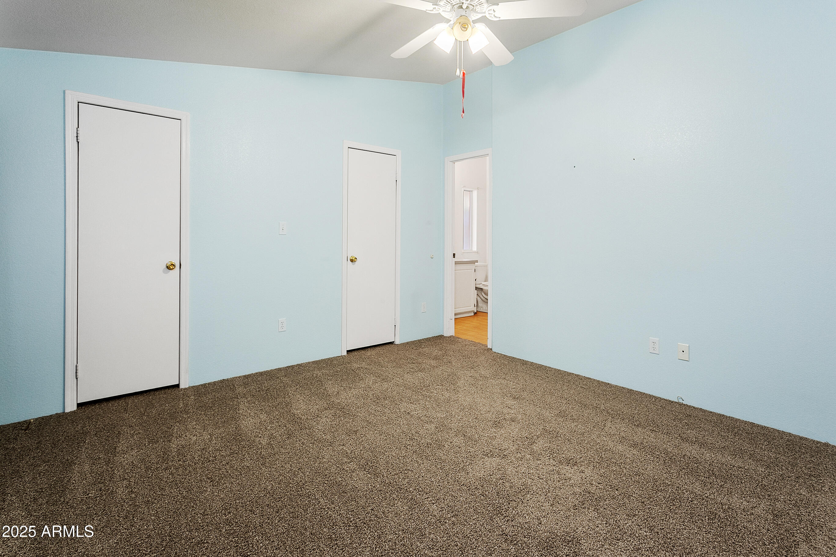 16416 North 33rd Way Phoenix, AZ 85032 - Photo 17 of 31 an empty room with a chandelier fan