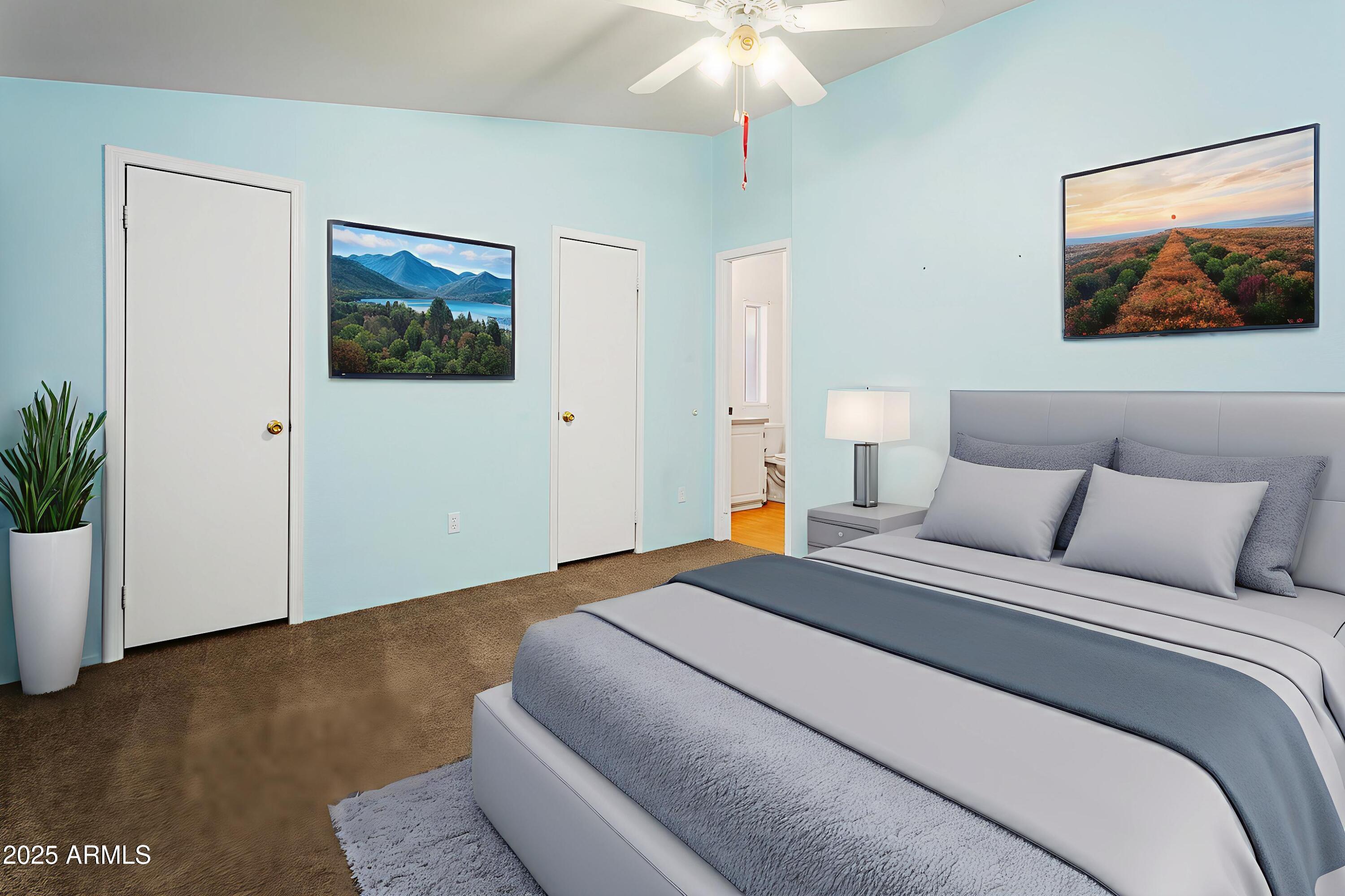 16416 North 33rd Way Phoenix, AZ 85032 - Photo 18 of 31 a bedroom with a large bed and a chandelier