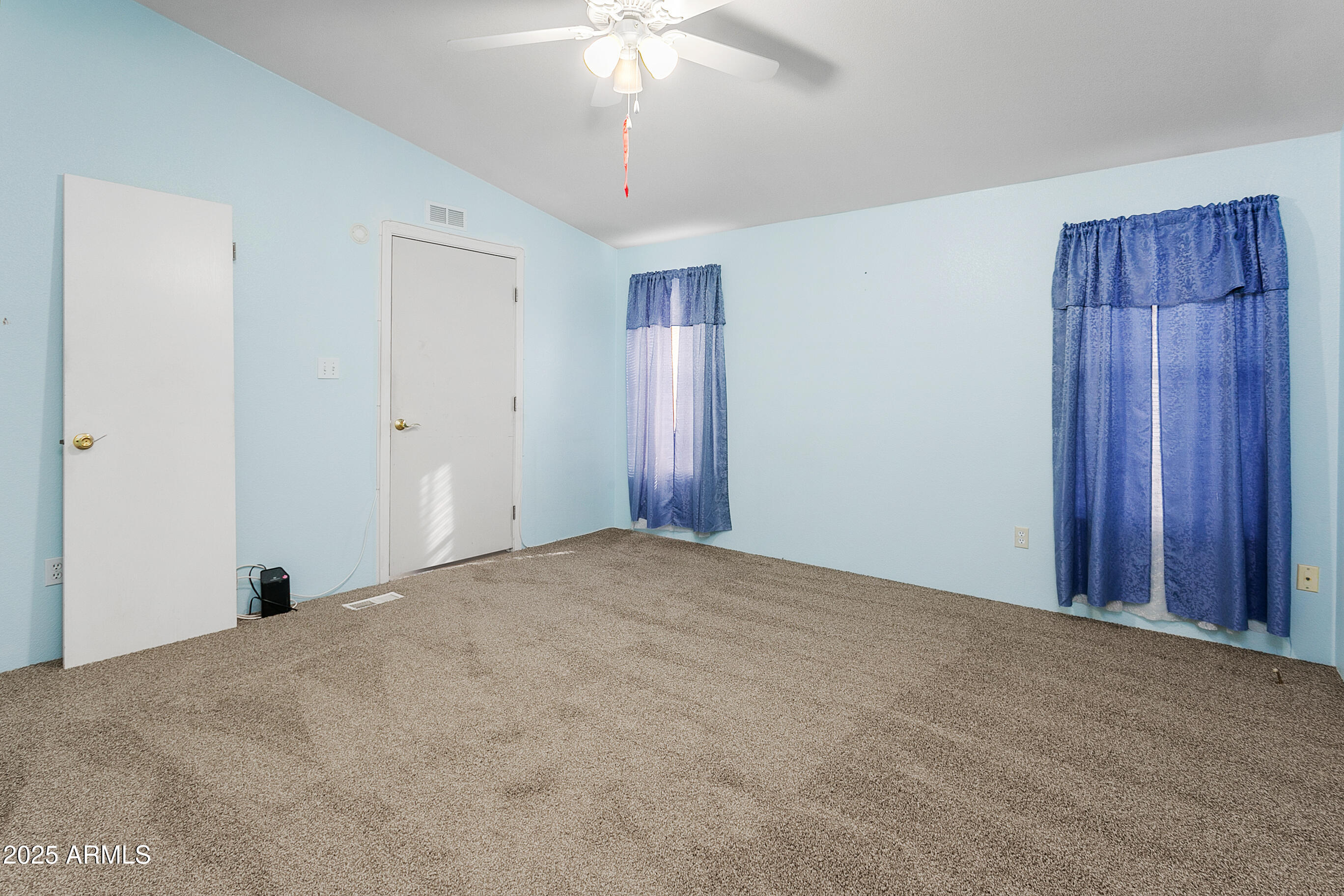 16416 North 33rd Way Phoenix, AZ 85032 - Photo 22 of 31 a view of a livingroom with a chandelier fan
