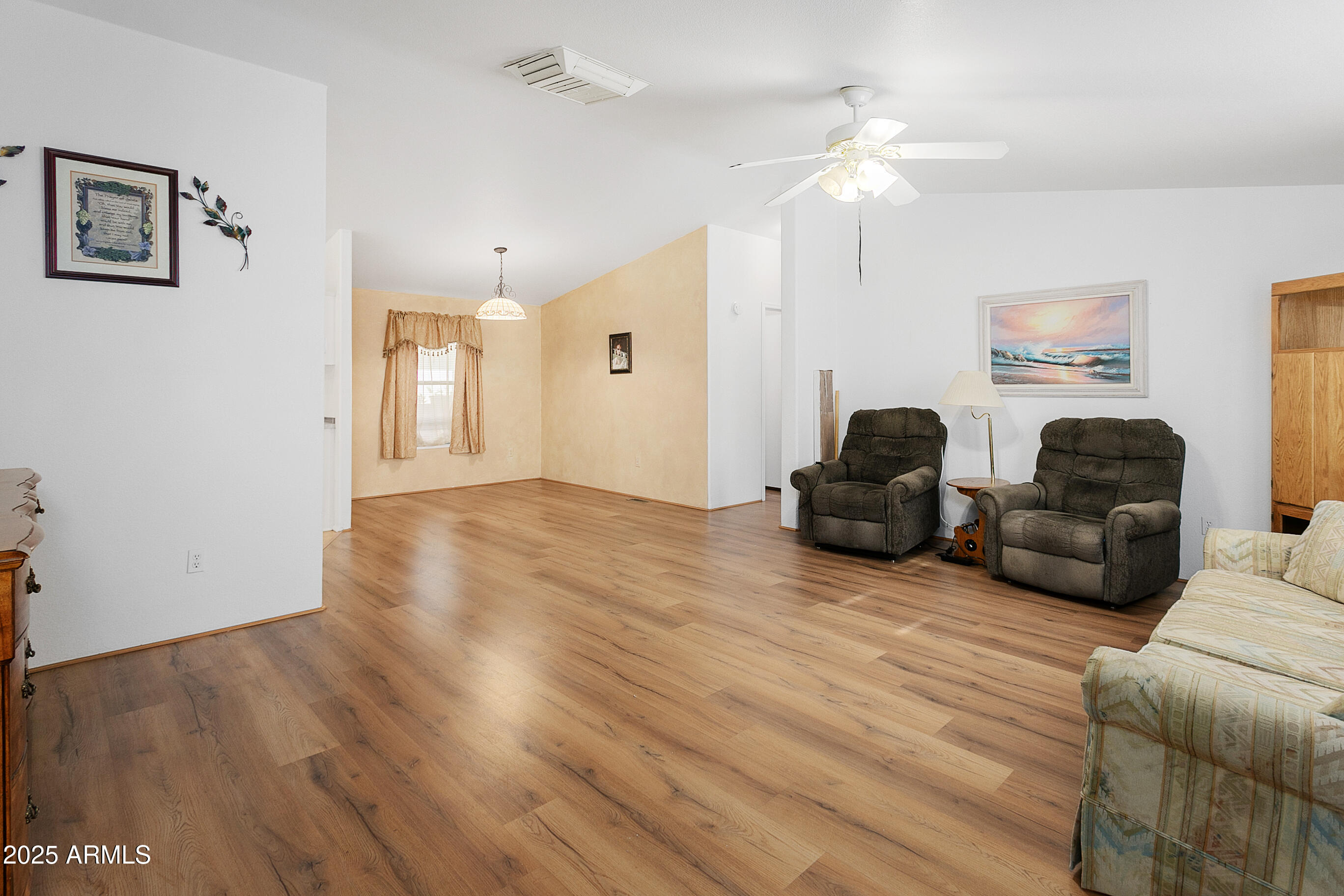 16416 North 33rd Way Phoenix, AZ 85032 - Photo 3 of 31 a living room with furniture and a chandelier