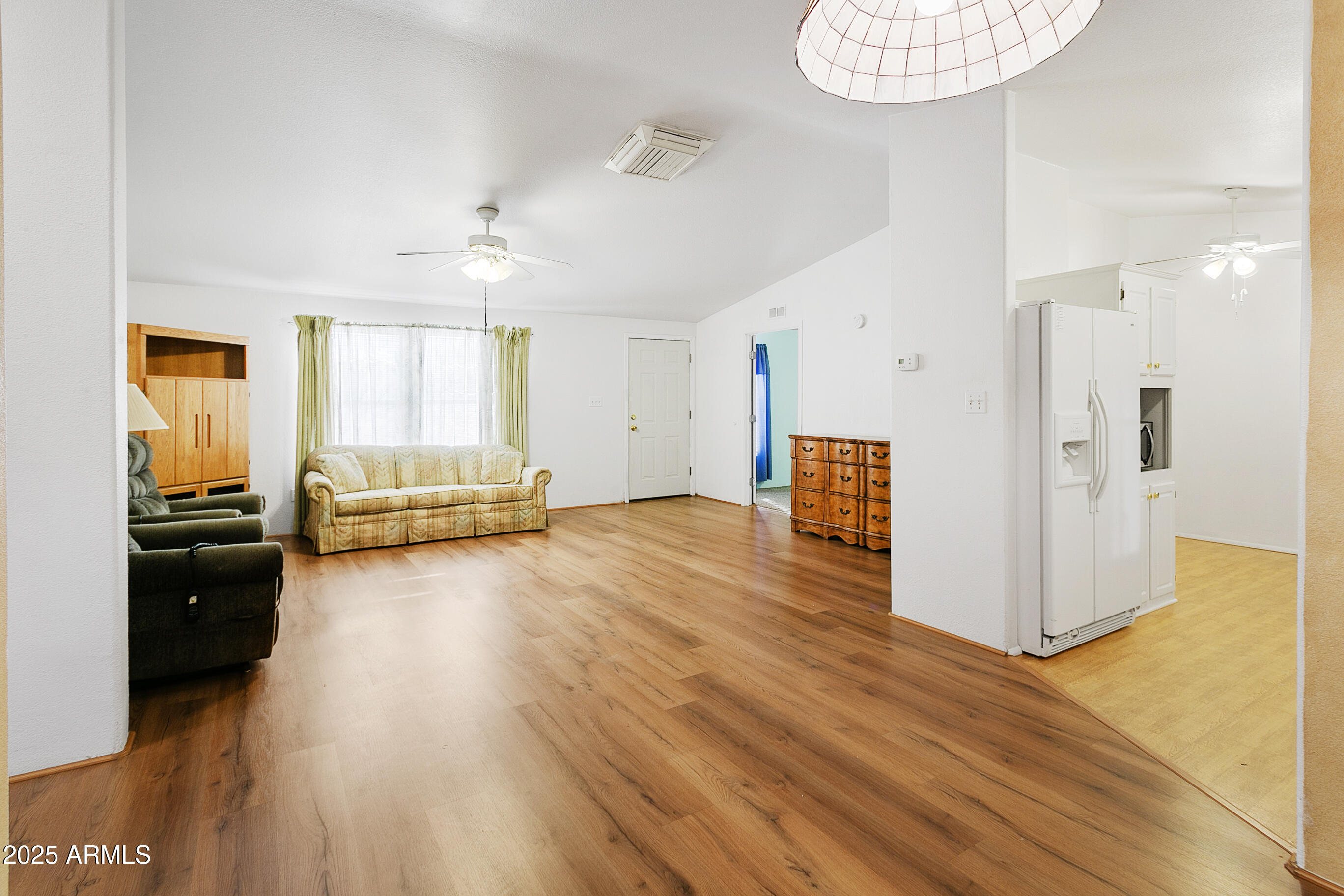 16416 North 33rd Way Phoenix, AZ 85032 - Photo 5 of 31 a view of a livingroom with furniture and a ceiling fan