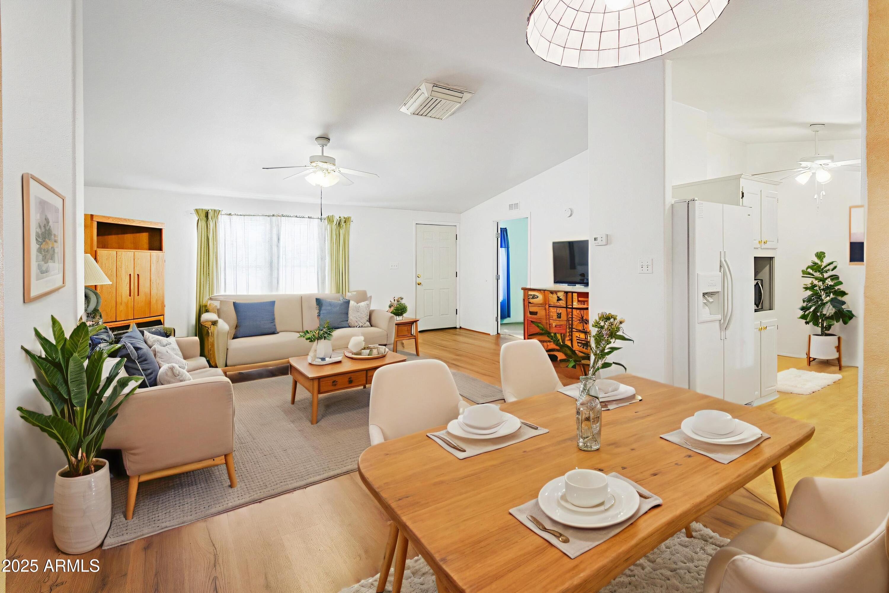 16416 North 33rd Way Phoenix, AZ 85032 - Photo 6 of 31 a view of a dining room with furniture and wooden floor