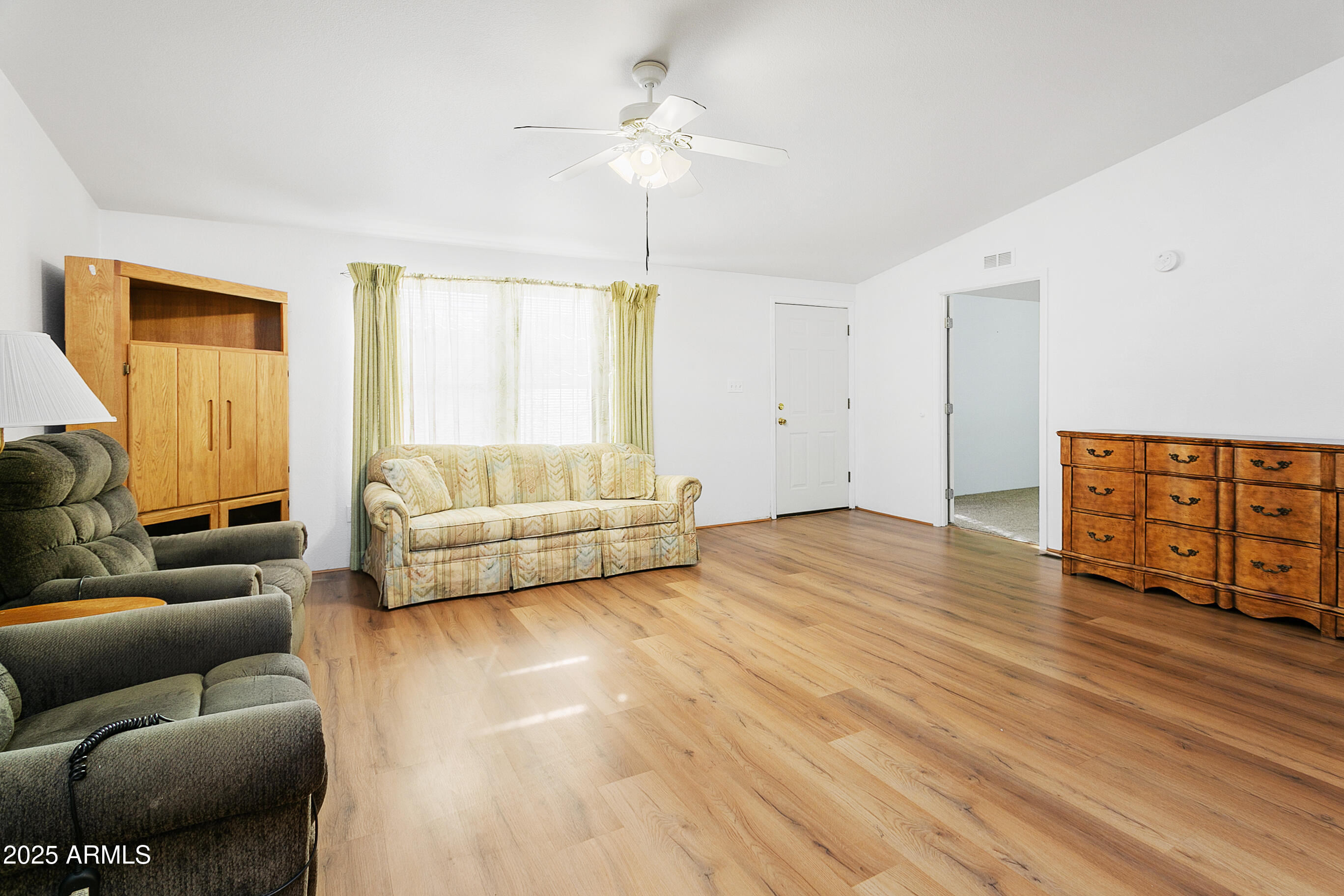16416 North 33rd Way Phoenix, AZ 85032 - Photo 7 of 31 a living room with furniture and a wooden floor