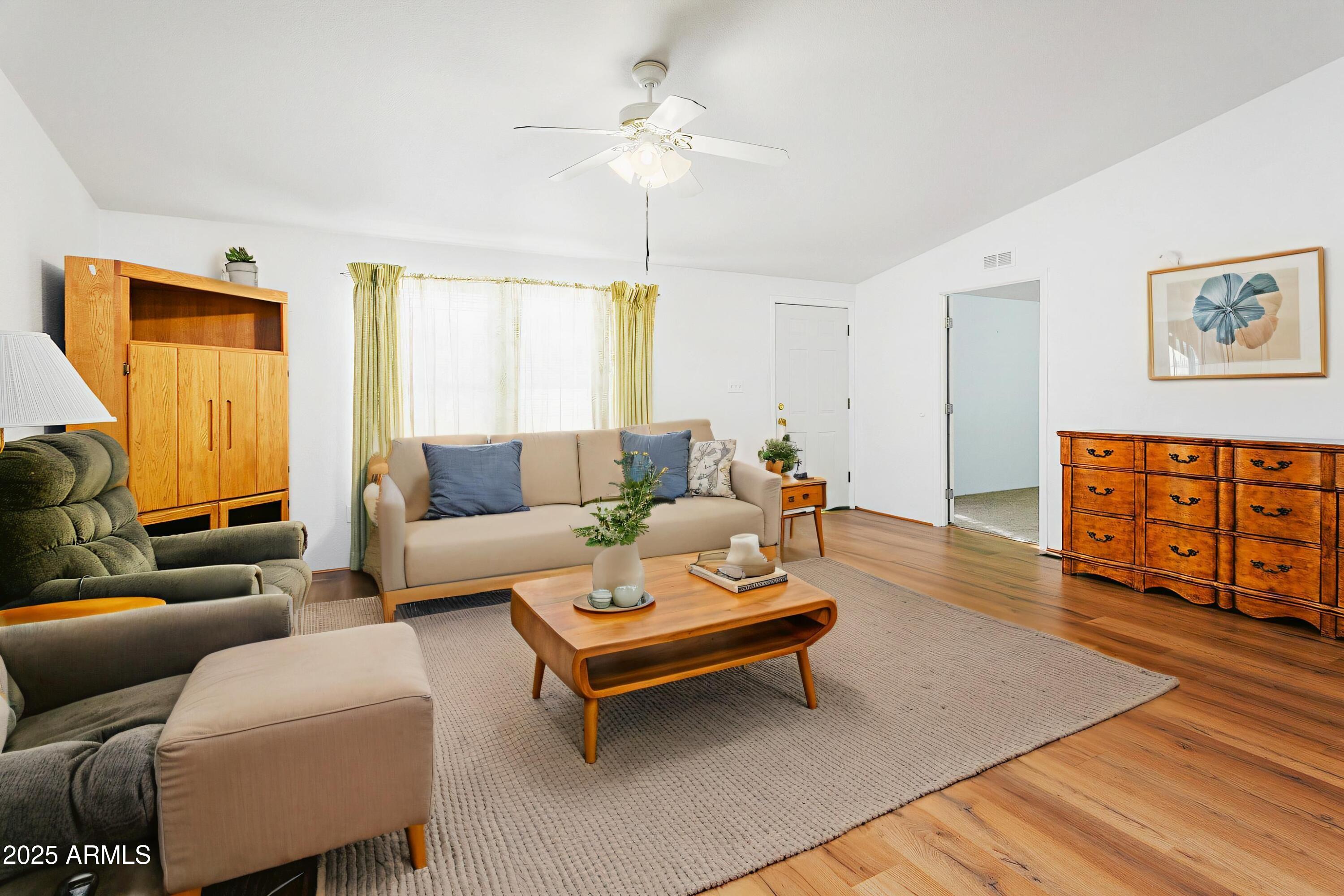 16416 North 33rd Way Phoenix, AZ 85032 - Photo 8 of 31 a living room with furniture and a wooden floor