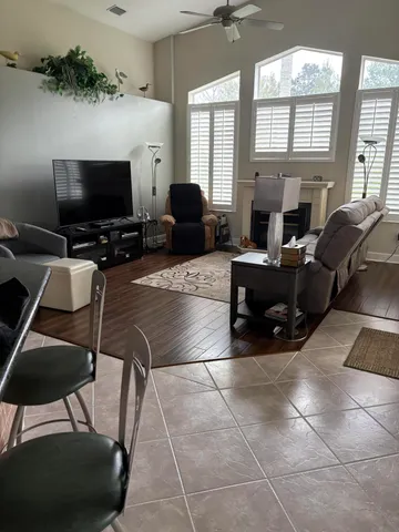 a white toilet sitting next to a shower
