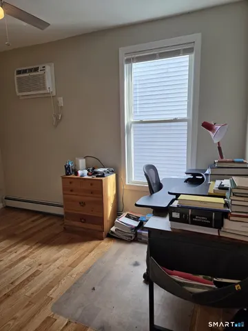 a view of a workspace with furniture