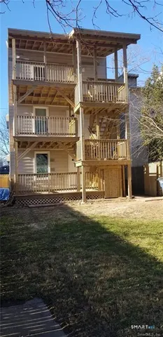 a sign board on the side of a brick building