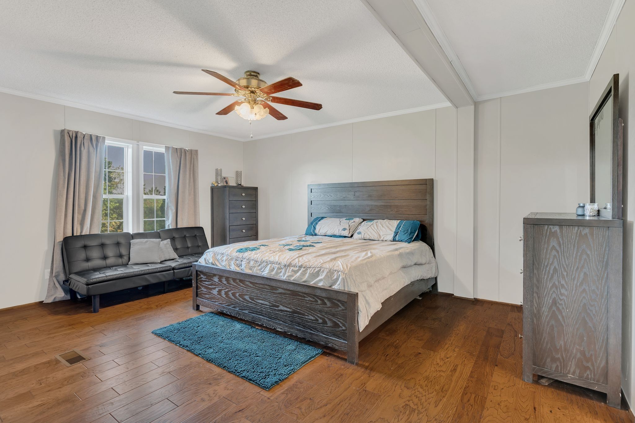960 Harsh Lane Castalian Springs, TN 37031 - Photo 17 of 51 a bedroom with a bed couch and a window