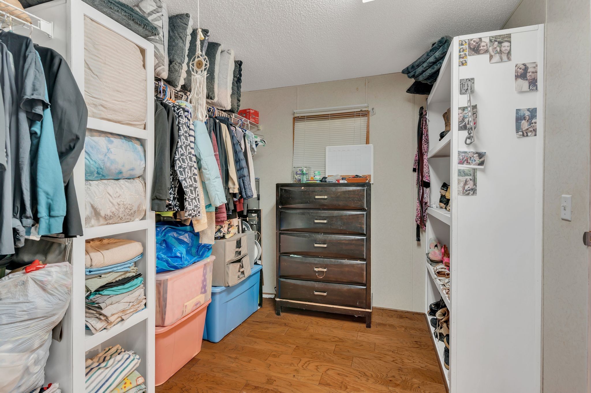 960 Harsh Lane Castalian Springs, TN 37031 - Photo 20 of 51 a view of walk in closet with clothes
