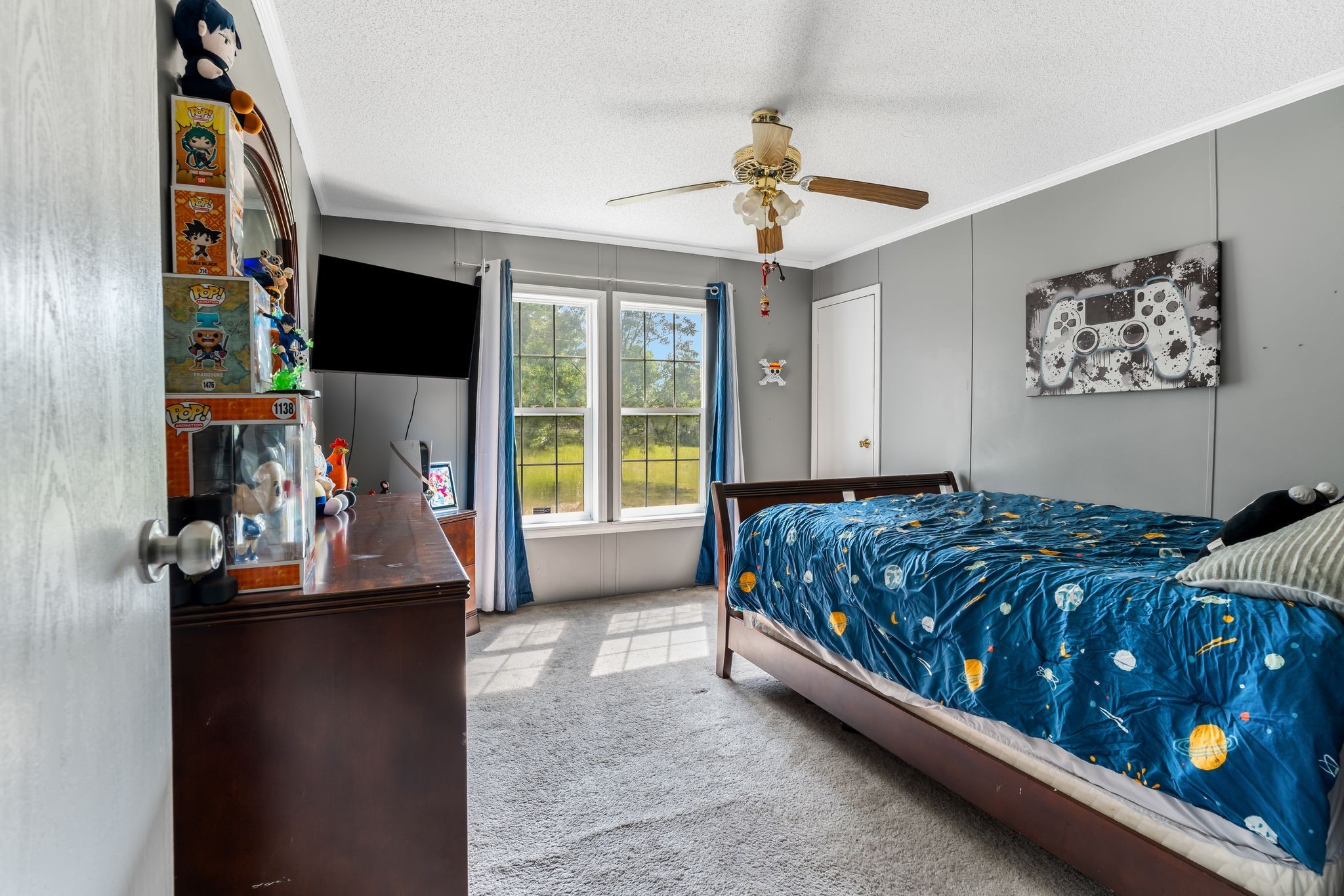 960 Harsh Lane Castalian Springs, TN 37031 - Photo 26 of 51 a bedroom with a bed and a flat tv screen on the wall