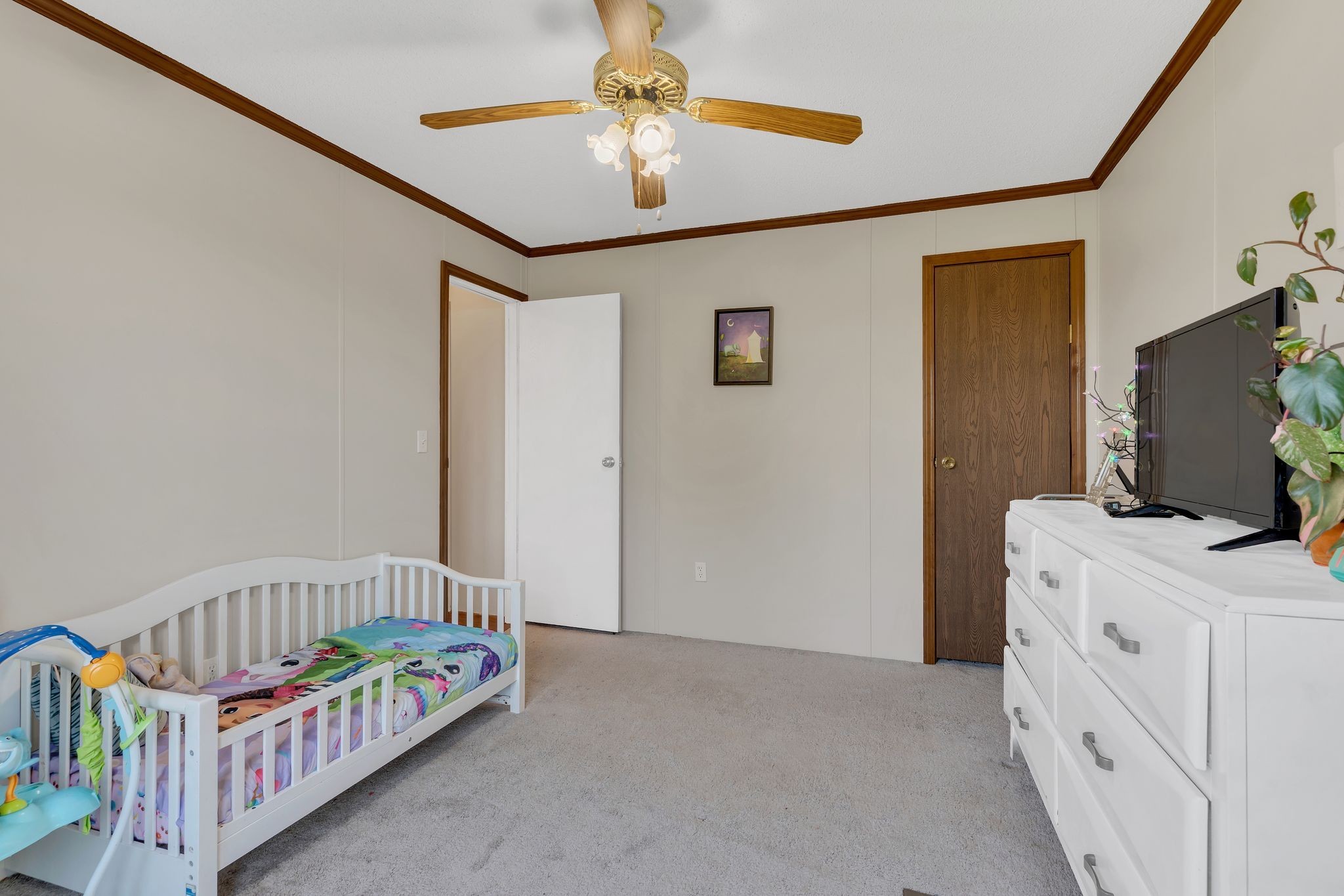 960 Harsh Lane Castalian Springs, TN 37031 - Photo 29 of 51 a bedroom with furniture and a baby crib