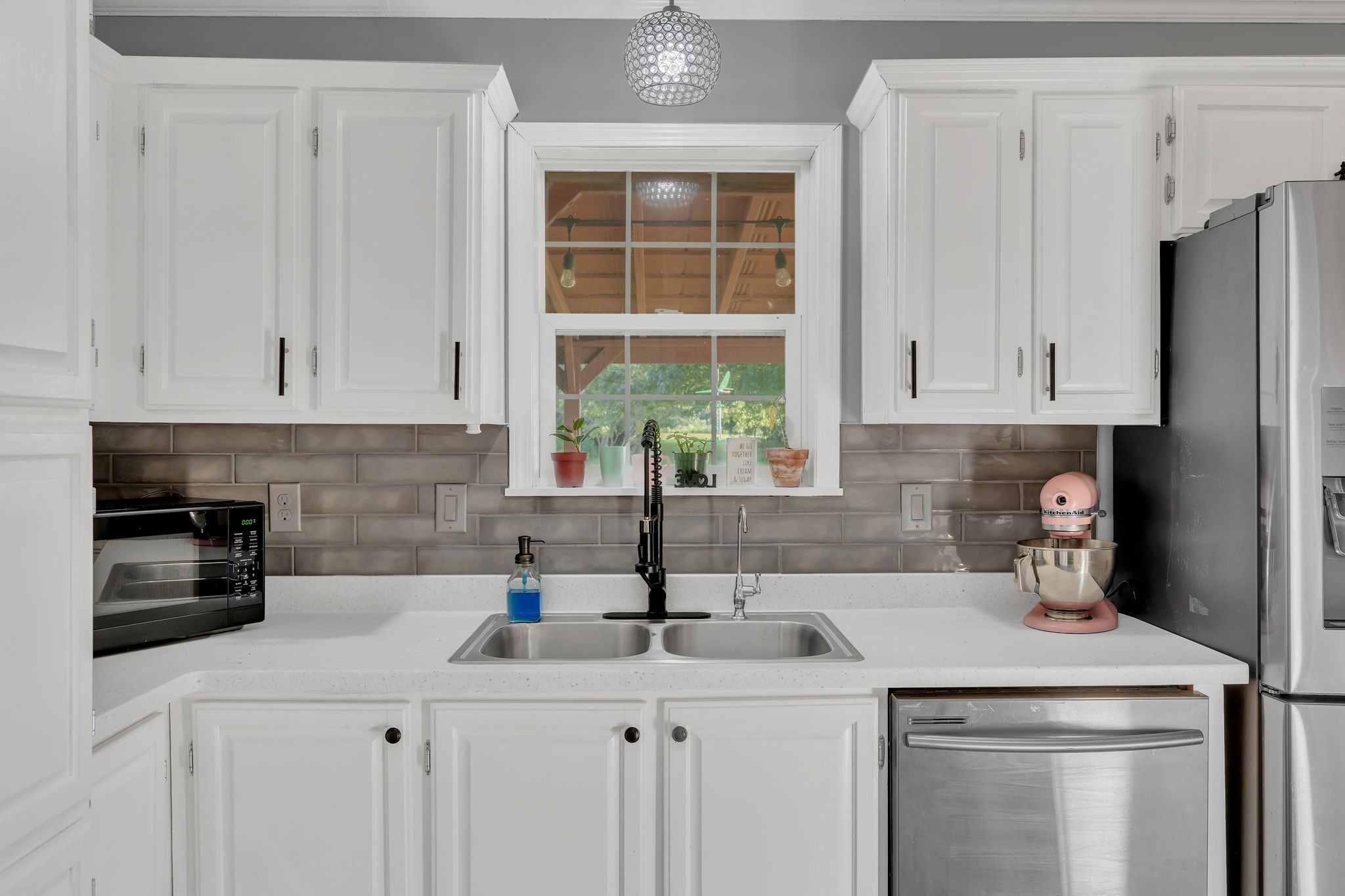 960 Harsh Lane Castalian Springs, TN 37031 - Photo 3 of 51 a kitchen with stainless steel appliances white cabinets and a sink
