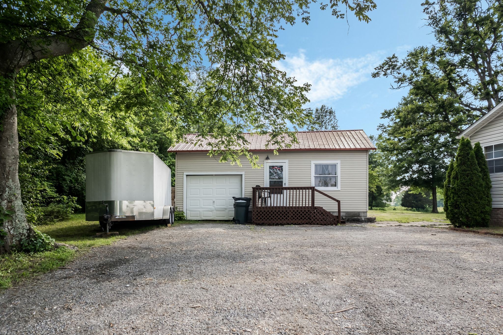 960 Harsh Lane Castalian Springs, TN 37031 - Photo 33 of 51 a view of a house with a yard and garage
