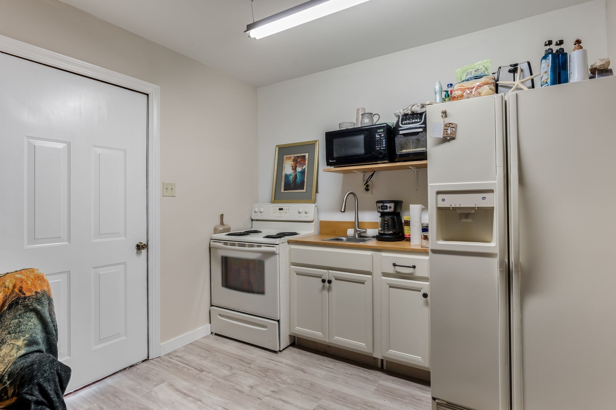960 Harsh Lane Castalian Springs, TN 37031 - Photo 37 of 51 a kitchen with a refrigerator and a sink