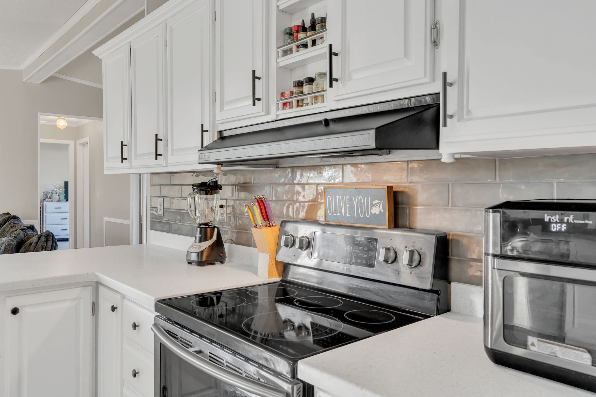 960 Harsh Lane Castalian Springs, TN 37031 - Photo 5 of 51 a kitchen with stainless steel appliances granite countertop a stove and cabinets