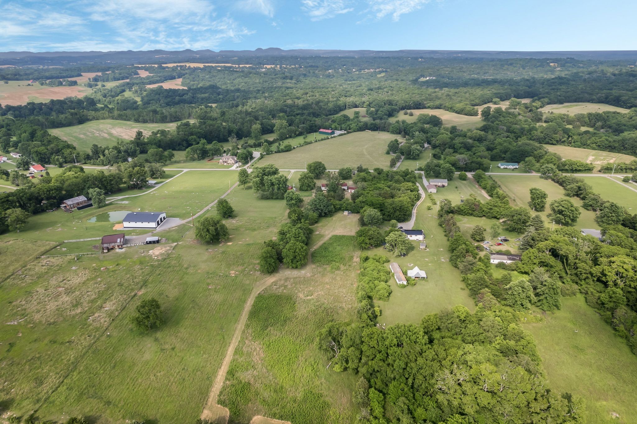 960 Harsh Lane Castalian Springs, TN 37031 - Photo 51 of 51 an aerial view of residential houses with outdoor space and trees