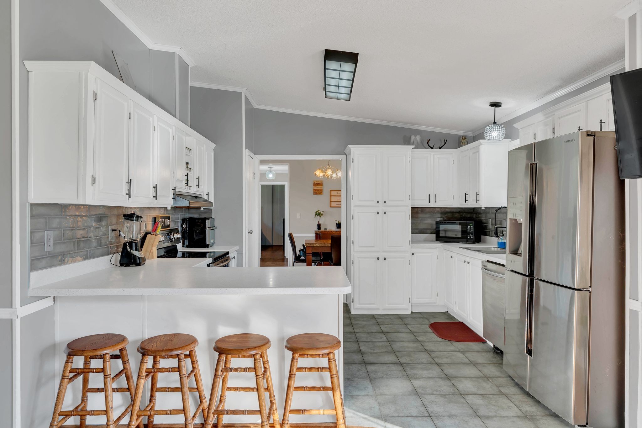960 Harsh Lane Castalian Springs, TN 37031 - Photo 6 of 51 a kitchen with stainless steel appliances granite countertop a refrigerator and a stove top oven
