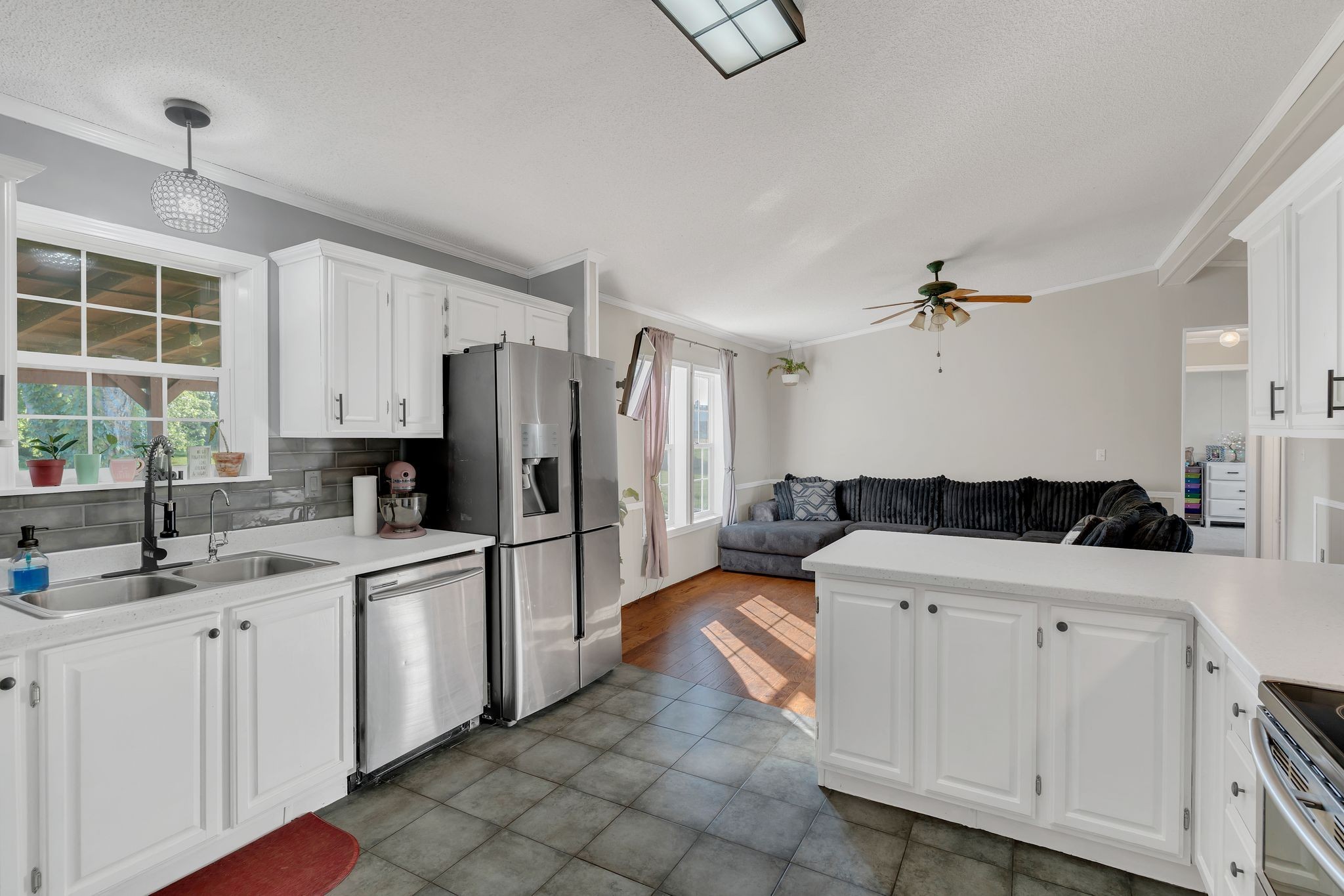 960 Harsh Lane Castalian Springs, TN 37031 - Photo 8 of 51 a kitchen with a sink stove and refrigerator