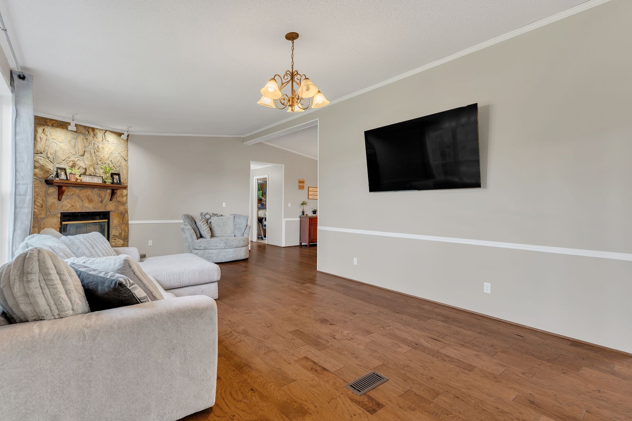 960 Harsh Lane Castalian Springs, TN 37031 - Photo 10 of 51 a living room with furniture and a flat screen tv