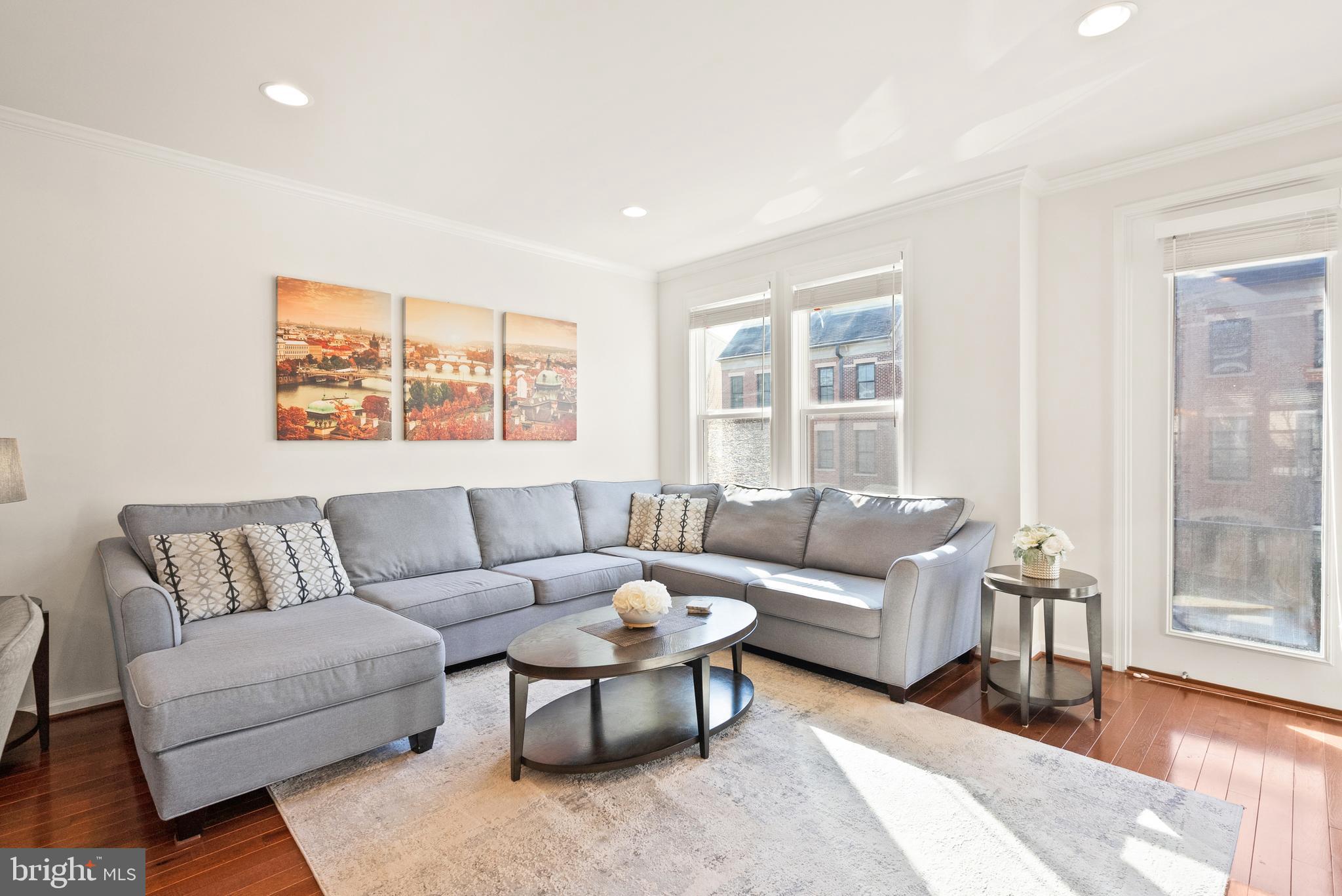 42274 Riggins Ridge Terrace Brambleton, VA 20148 - Photo 22 of 56 a living room with furniture and a large window