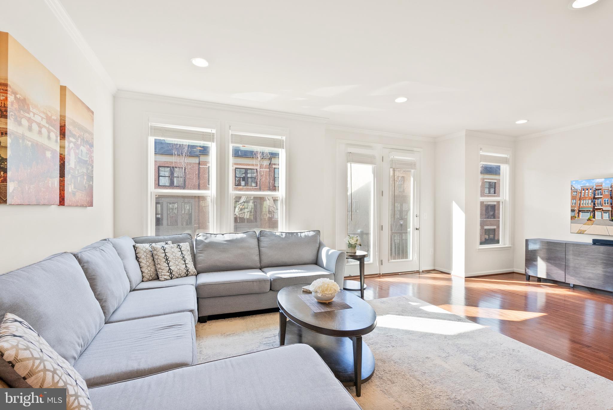 42274 Riggins Ridge Terrace Brambleton, VA 20148 - Photo 23 of 56 a living room with furniture and a large window