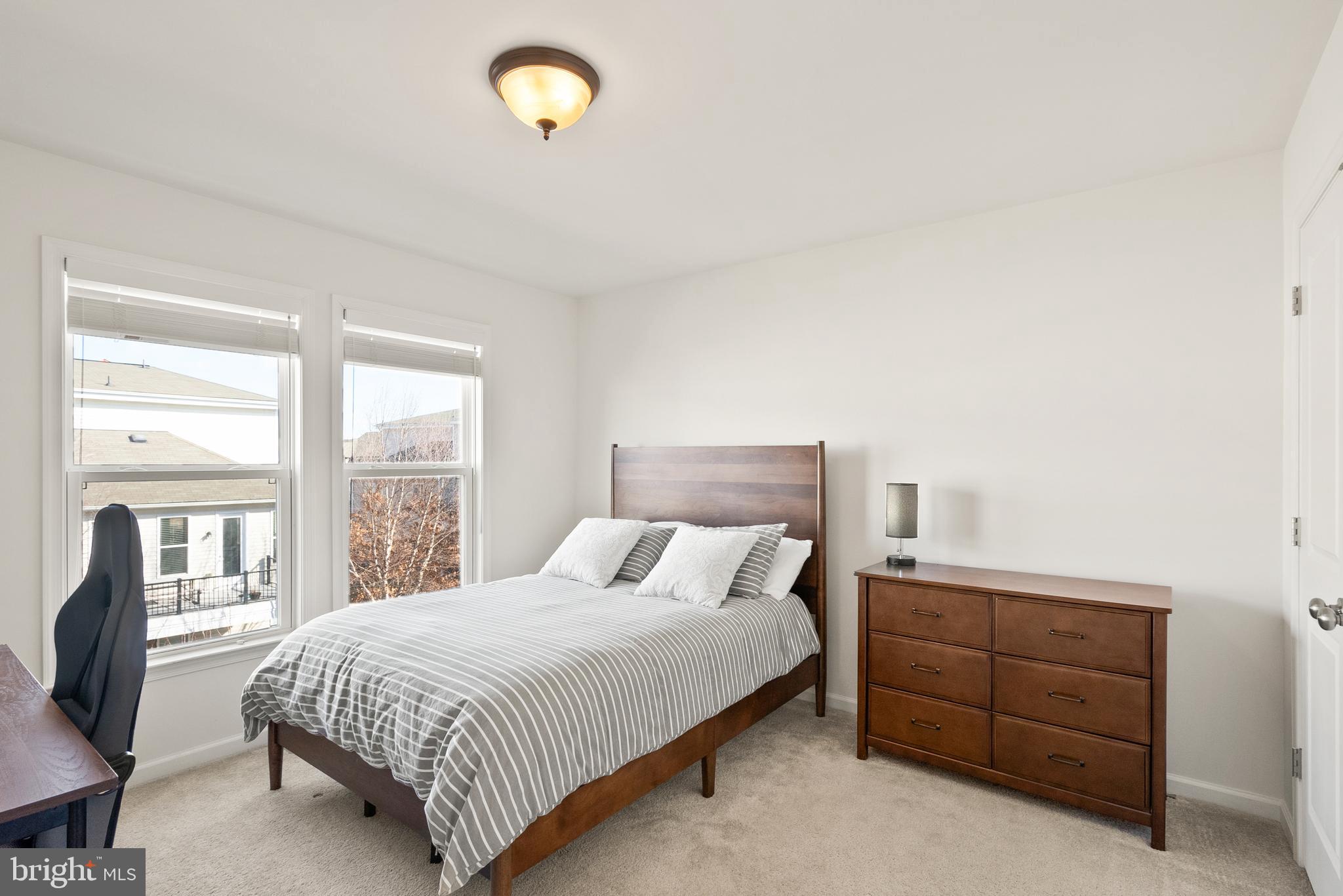 42274 Riggins Ridge Terrace Brambleton, VA 20148 - Photo 34 of 56 a bedroom with a bed and a window