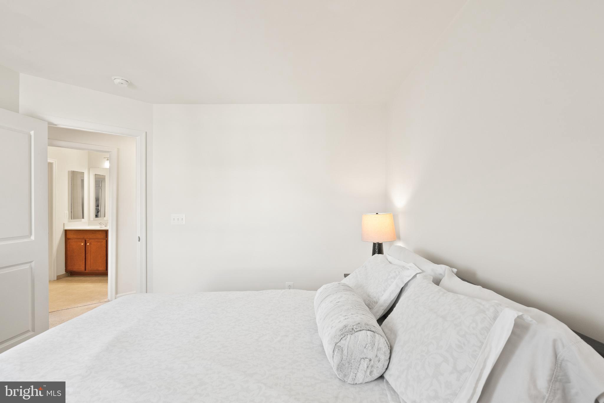 42274 Riggins Ridge Terrace Brambleton, VA 20148 - Photo 36 of 56 a bed room with a bed