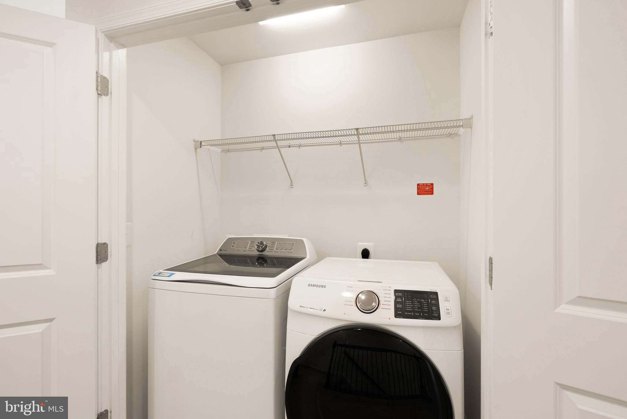 42274 Riggins Ridge Terrace Brambleton, VA 20148 - Photo 38 of 56 a utility room with dryer and washer