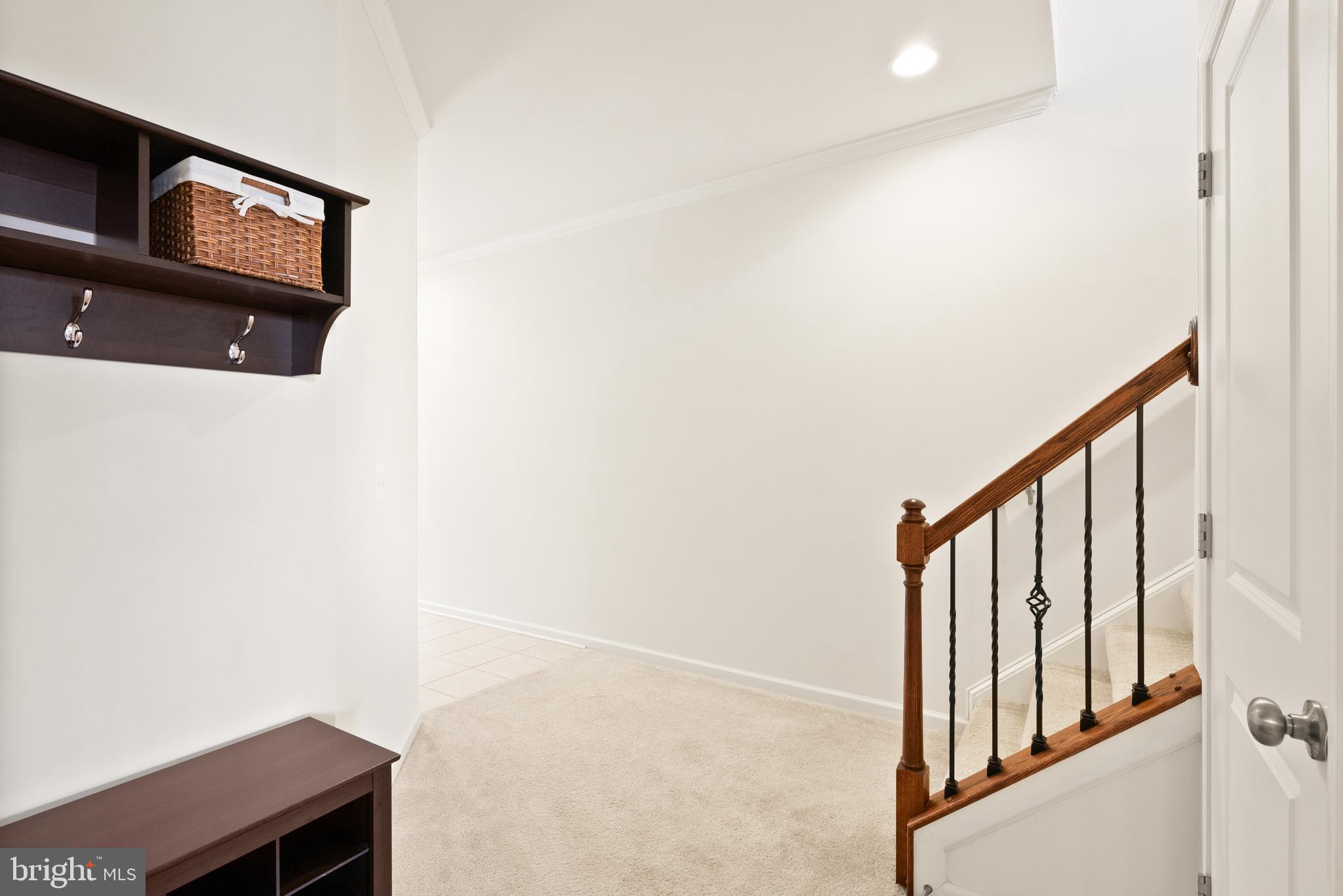 42274 Riggins Ridge Terrace Brambleton, VA 20148 - Photo 39 of 56 a view of a hallway with staircase