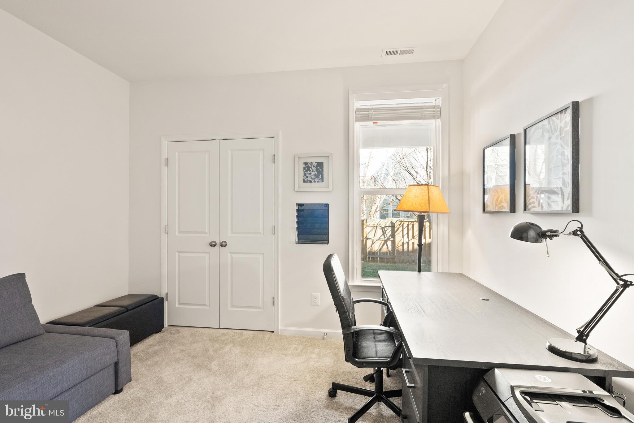 42274 Riggins Ridge Terrace Brambleton, VA 20148 - Photo 45 of 56 a living room with furniture and a table