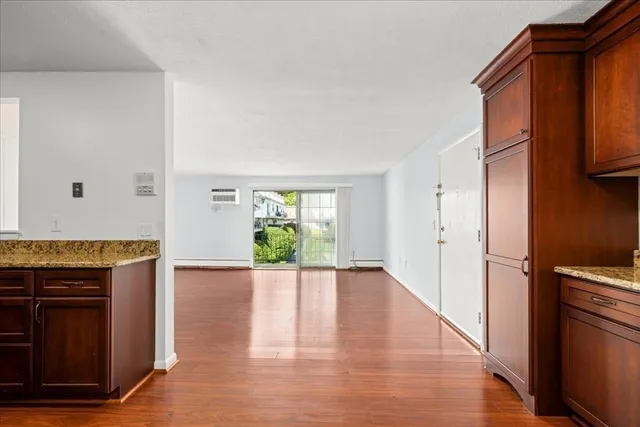 a kitchen with stainless steel appliances granite countertop a refrigerator and a stove