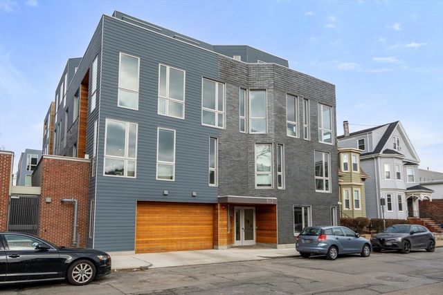 a car parked in front of a building