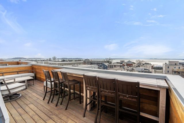 a view of roof with seating area and furniture
