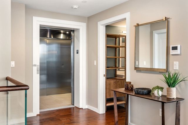 a view of a livingroom with furniture and wooden floor