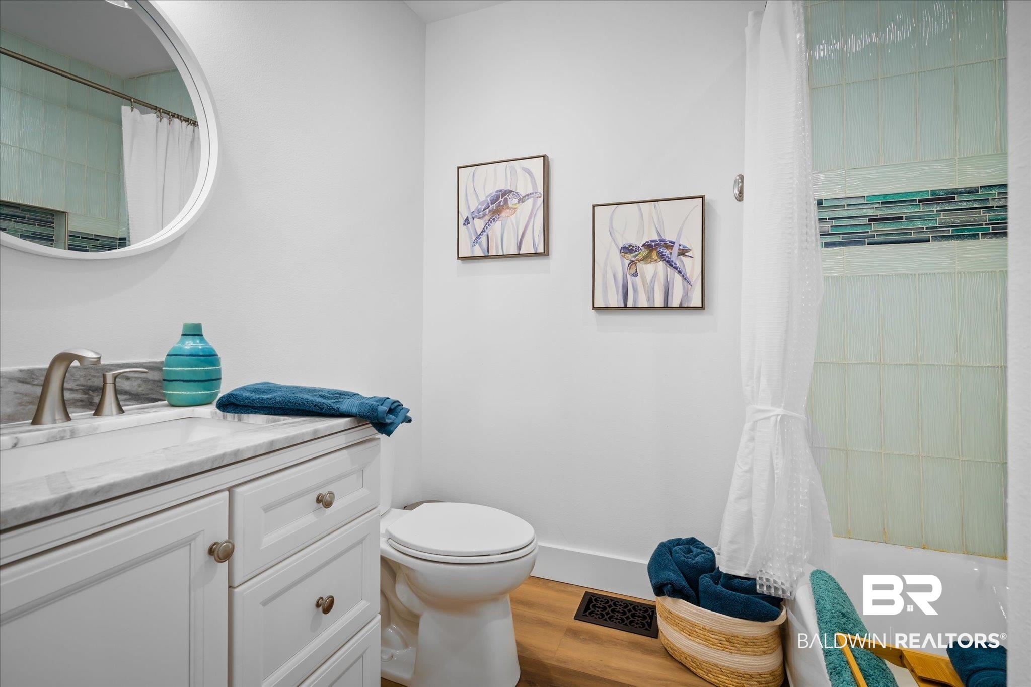 15111 Regus Road Coden, AL 36523 - Photo 16 of 35 Bathroom featuring vanity, wood finished floors, and shower / tub combo with curtain
